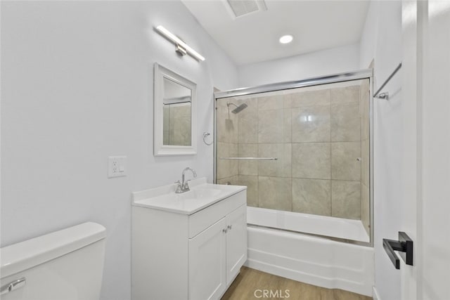 11177 Tamarack Ave, Pacoima, CA 91331 - bathroom with toilet, bath / shower combo with glass door, wood finished floors, and vanity