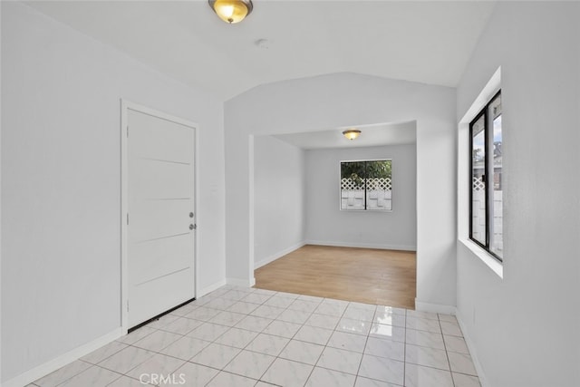 11177 Tamarack Ave, Pacoima, CA 91331 - spare room featuring vaulted ceiling, light tile patterned floors, baseboards, and a smoke detector