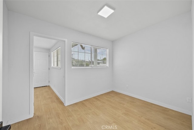 11177 Tamarack Ave, Pacoima, CA 91331 - empty room featuring light wood-style floors and baseboards