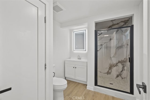 11177 Tamarack Ave, Pacoima, CA 91331 - bathroom featuring toilet, wood finished floors, a marble finish shower, and vanity