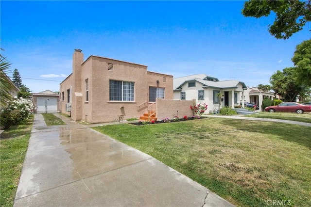 5939 5th Ave, Hyde Park, CA 90043 - view of front of property with stucco siding, a front lawn, an outdoor structure, driveway, and a chimney
