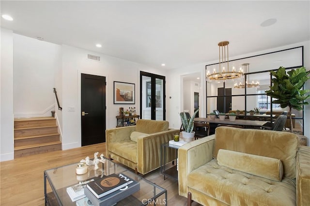 6 Shively Rd, Ladera Ranch, CA 92694 - living area with a chandelier, wood finished floors, stairs, recessed lighting, and baseboards