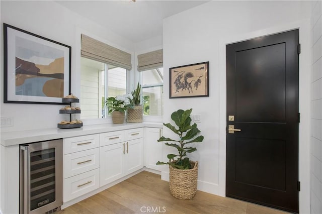 6 Shively Rd, Ladera Ranch, CA 92694 - indoor dry bar with beverage cooler and light wood-style flooring