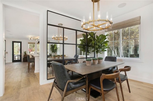 6 Shively Rd, Ladera Ranch, CA 92694 - dining space with a chandelier, light wood-style flooring, and baseboards