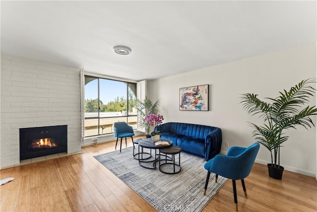 4227 Freedom Dr Unit 304, Calabasas, CA 91302 - living area featuring wood finished floors, a fireplace, and baseboards