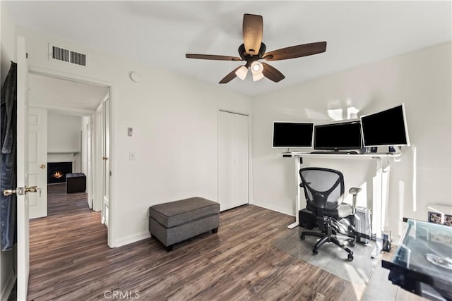 4227 Freedom Dr Unit 304, Calabasas, CA 91302 - office featuring wood finished floors, ceiling fan, baseboards, and a lit fireplace