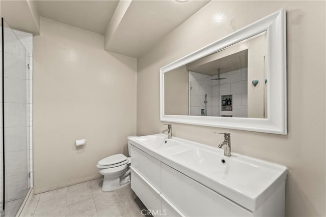 4227 Freedom Dr Unit 304, Calabasas, CA 91302 - full bath featuring double vanity, toilet, a tile shower, baseboards, and tile patterned flooring