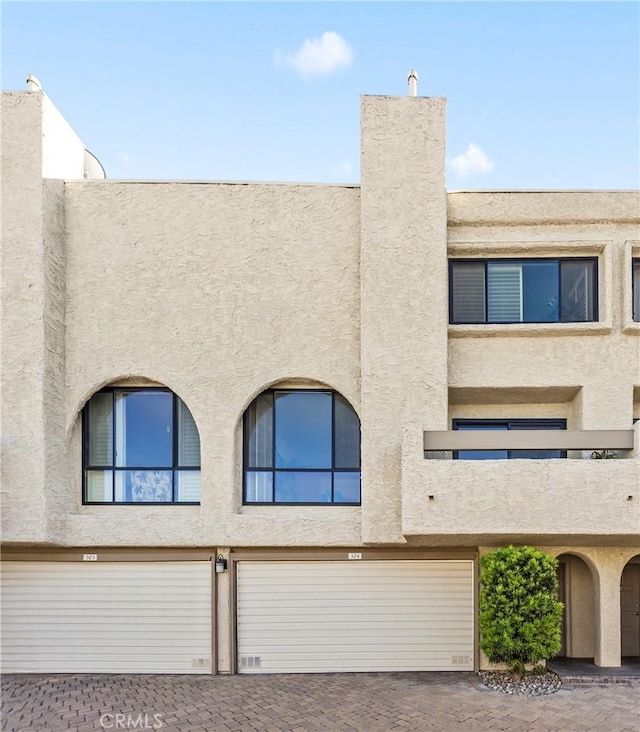 4227 Freedom Dr Unit 304, Calabasas, CA 91302 - view of building exterior with an attached garage and driveway