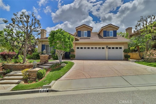 536 Granite Hills St, Simi Valley, CA 93065 - view of front of property with concrete driveway, stucco siding, and a garage