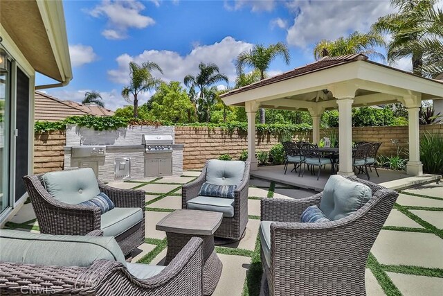 536 Granite Hills St, Simi Valley, CA 93065 - view of patio featuring outdoor lounge area, grilling area, fence, and exterior kitchen
