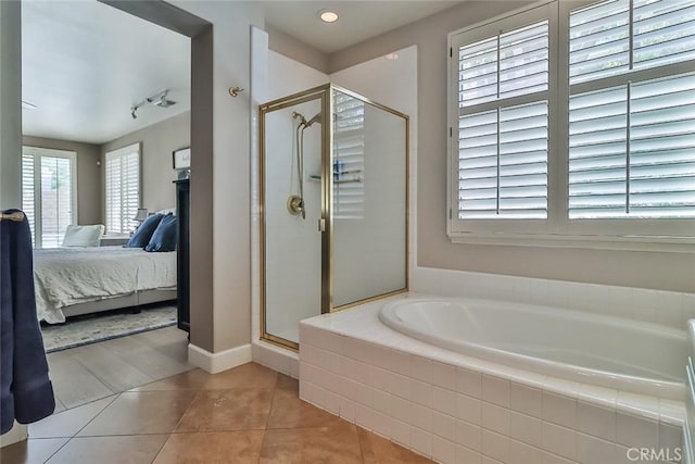 536 Granite Hills St, Simi Valley, CA 93065 - ensuite bathroom featuring a bath, a shower stall, tile patterned floors, and baseboards