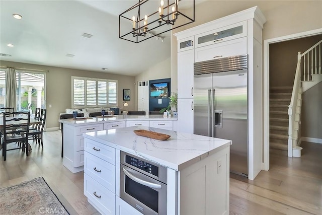 536 Granite Hills St, Simi Valley, CA 93065 - kitchen with appliances with stainless steel finishes, a peninsula, light wood-style floors, a kitchen island, and recessed lighting