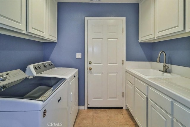 536 Granite Hills St, Simi Valley, CA 93065 - laundry area featuring separate washer and dryer, cabinet space, and light tile patterned floors