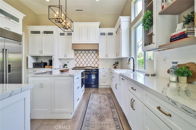 536 Granite Hills St, Simi Valley, CA 93065 - kitchen with high end appliances, a sink, white cabinets, pendant lighting, and recessed lighting
