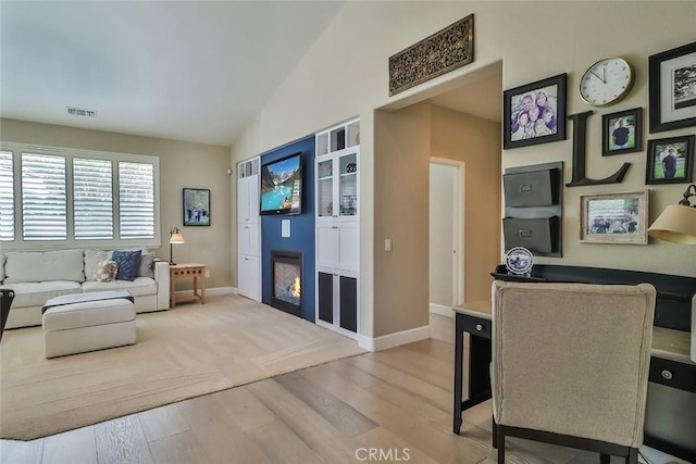 536 Granite Hills St, Simi Valley, CA 93065 - living area featuring wood finished floors, baseboards, and lofted ceiling