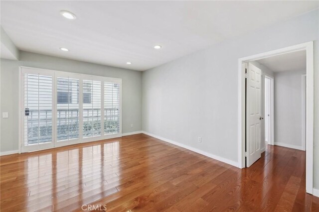 13220 Valleyheart Dr Unit 106, Studio City, CA 91604 - empty room featuring wood finished floors, baseboards, and recessed lighting