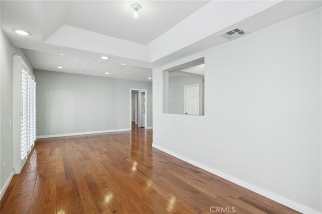 13220 Valleyheart Dr Unit 106, Studio City, CA 91604 - spare room with hardwood / wood-style floors, baseboards, recessed lighting, and a raised ceiling