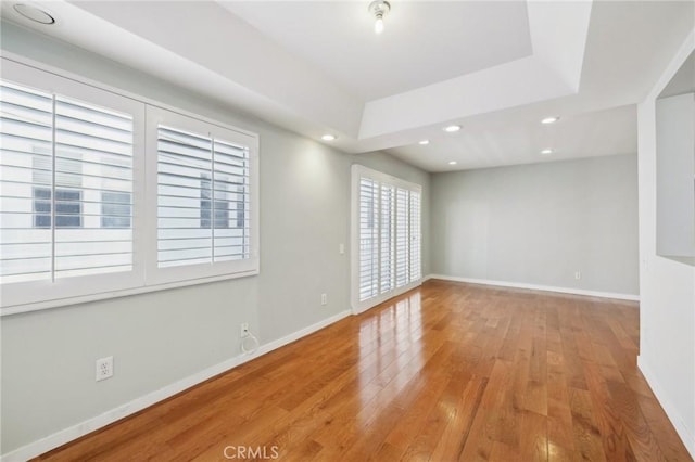 13220 Valleyheart Dr Unit 106, Studio City, CA 91604 - spare room with wood finished floors, baseboards, recessed lighting, and a tray ceiling