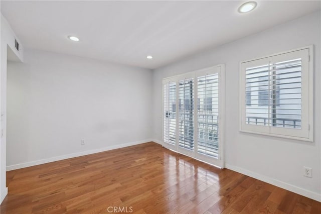 13220 Valleyheart Dr Unit 106, Studio City, CA 91604 - empty room featuring wood finished floors, baseboards, and recessed lighting