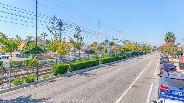 1327 Exposition Blvd, Los Angeles, CA 90018 - view of asphalt street with curbs and a residential view