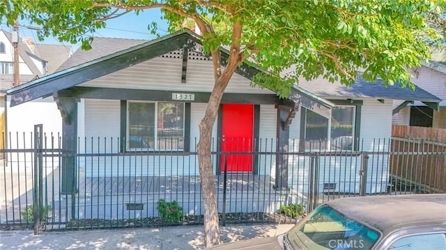 1327 Exposition Blvd, Los Angeles, CA 90018 - view of front of home featuring a fenced front yard and a porch