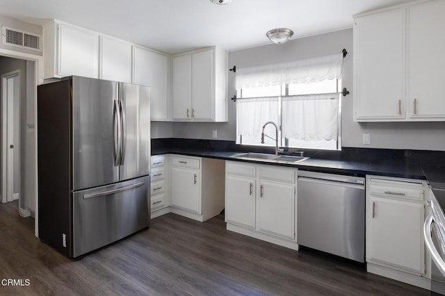 103 E Sierra Madre Blvd Unit E, Sierra Madre, CA 91024 - kitchen with stainless steel appliances, a sink, dark wood-style floors, and dark countertops