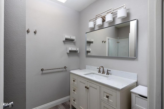 103 E Sierra Madre Blvd Unit E, Sierra Madre, CA 91024 - bathroom with vanity, baseboards, and wood finished floors