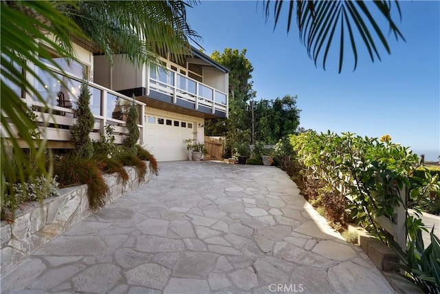 1961 San Remo Dr, Laguna Beach, CA 92651 - view of patio / terrace featuring a balcony, driveway, and an attached garage
