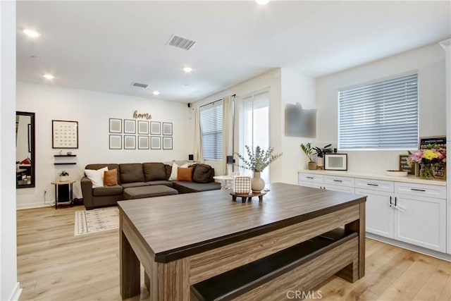 4085 E Liliana Paseo Unit 69, Ontario, CA 91764 - dining room with light wood-style floors, recessed lighting, and baseboards