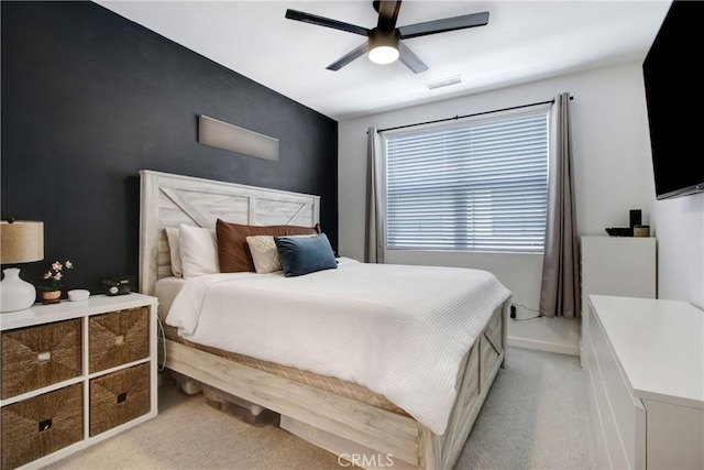 4085 E Liliana Paseo Unit 69, Ontario, CA 91764 - bedroom with light colored carpet and ceiling fan
