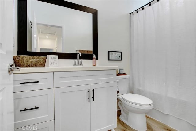 4085 E Liliana Paseo Unit 69, Ontario, CA 91764 - bathroom featuring toilet, vanity, wood finished floors, and shower / tub combo