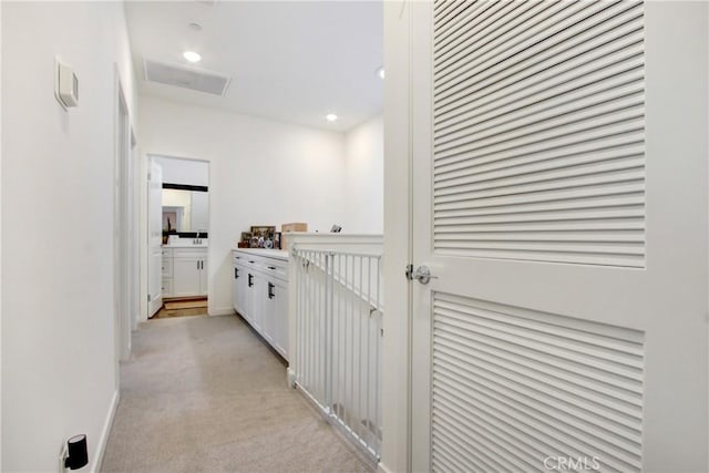 4085 E Liliana Paseo Unit 69, Ontario, CA 91764 - corridor featuring light carpet, recessed lighting, and baseboards