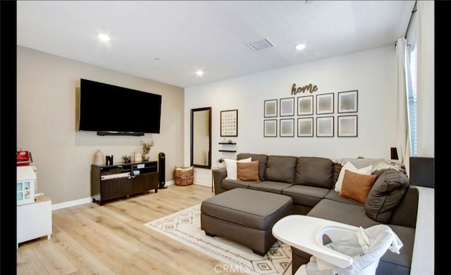 4085 E Liliana Paseo Unit 69, Ontario, CA 91764 - living area with light wood-style flooring and recessed lighting