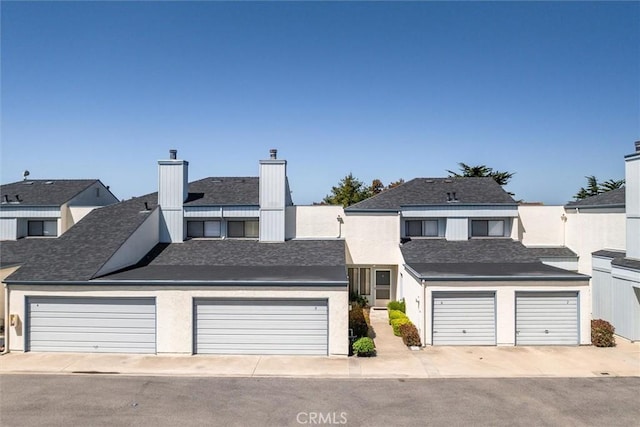391 Sequoia St Unit 5, Morro Bay, CA 93442 - view of front of home with a chimney and stucco siding