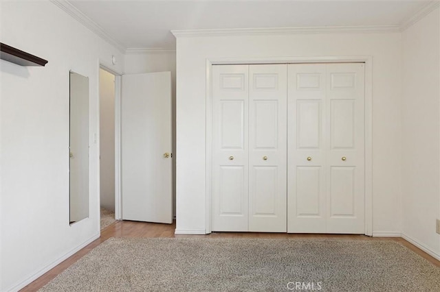 391 Sequoia St Unit 5, Morro Bay, CA 93442 - unfurnished bedroom with crown molding, wood finished floors, a closet, and baseboards