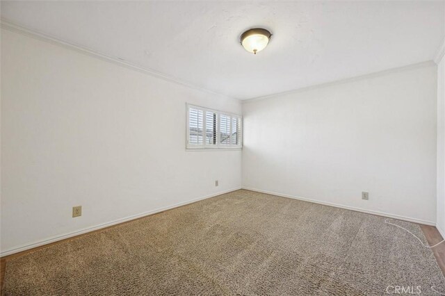 391 Sequoia St Unit 5, Morro Bay, CA 93442 - spare room with ornamental molding, carpet floors, and baseboards