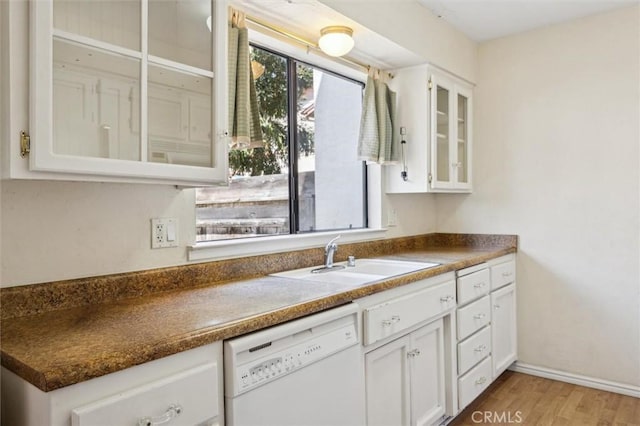 391 Sequoia St Unit 5, Morro Bay, CA 93442 - kitchen featuring white dishwasher, a sink, glass insert cabinets, white cabinetry, and light wood-style floors