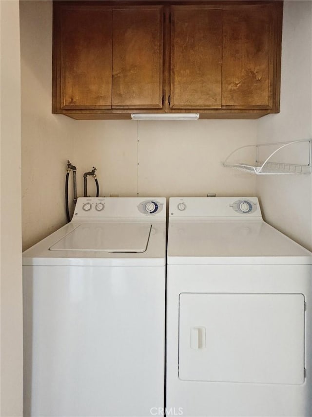 391 Sequoia St Unit 5, Morro Bay, CA 93442 - clothes washing area featuring independent washer and dryer and cabinet space