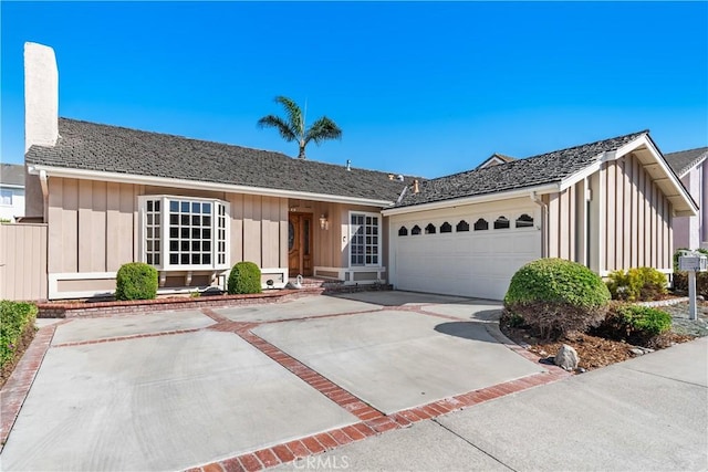 18 Blazing Star, Irvine, CA 92604 - ranch-style home with board and batten siding, a garage, concrete driveway, and a chimney