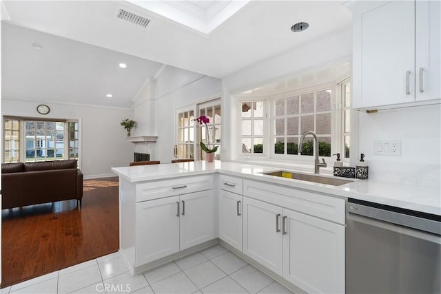 18 Blazing Star, Irvine, CA 92604 - kitchen featuring stainless steel dishwasher, a sink, ornamental molding, open floor plan, and lofted ceiling