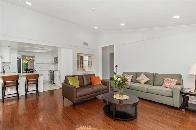 18 Blazing Star, Irvine, CA 92604 - living area with wood finished floors, ornamental molding, recessed lighting, and a chandelier