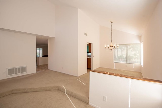 2432 Live Oak Rd, Escondido, CA 92029 - unfurnished living room with light colored carpet, a chandelier, high vaulted ceiling, and baseboards