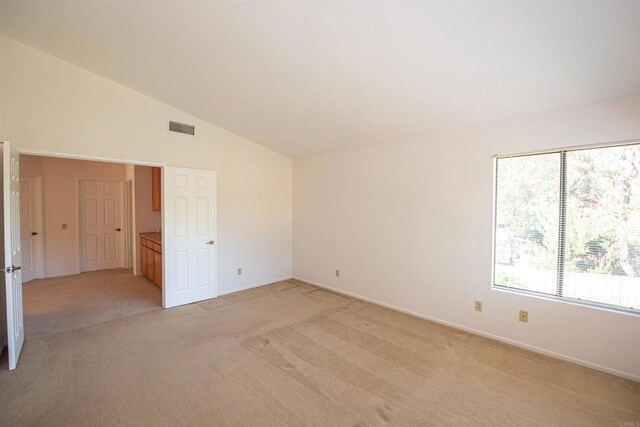 2432 Live Oak Rd, Escondido, CA 92029 - unfurnished room with light colored carpet, vaulted ceiling, and baseboards