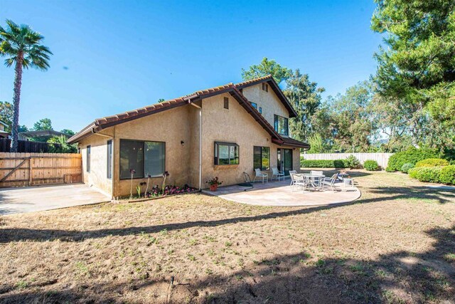 2432 Live Oak Rd, Escondido, CA 92029 - rear view of property with a patio area, a fenced backyard, and stucco siding
