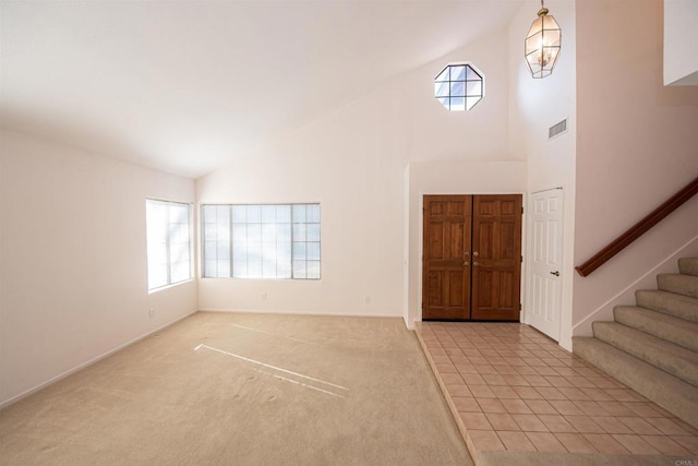 2432 Live Oak Rd, Escondido, CA 92029 - entryway featuring high vaulted ceiling, stairway, carpet, and baseboards
