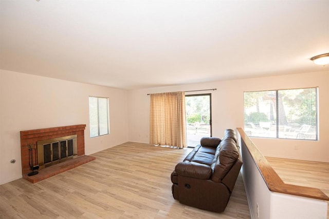2432 Live Oak Rd, Escondido, CA 92029 - living area with light wood finished floors and a brick fireplace