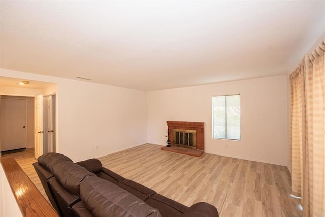 2432 Live Oak Rd, Escondido, CA 92029 - living room with light wood-style flooring and a brick fireplace