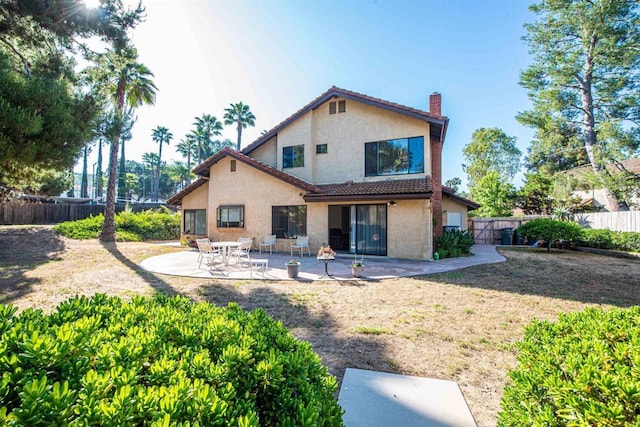 2432 Live Oak Rd, Escondido, CA 92029 - back of house featuring stucco siding, a chimney, a patio, and a tiled roof