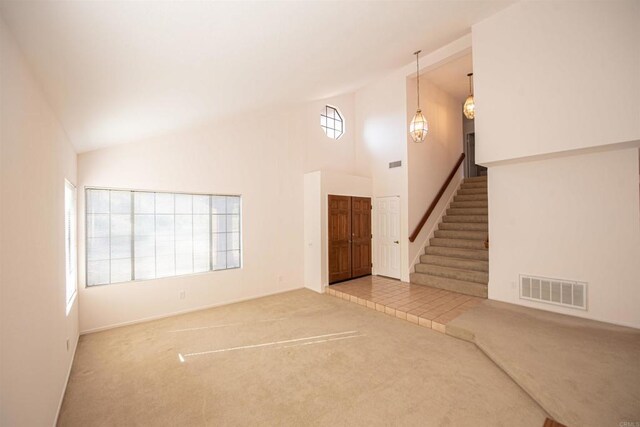 2432 Live Oak Rd, Escondido, CA 92029 - unfurnished living room featuring carpet, stairway, high vaulted ceiling, and baseboards