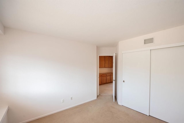 2432 Live Oak Rd, Escondido, CA 92029 - unfurnished bedroom featuring light carpet, a closet, and baseboards